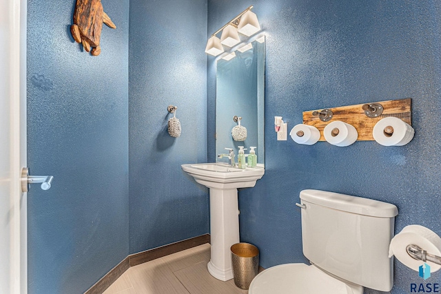 511 S 2nd Ave, Sioux Falls, SD 57104 - half bathroom with toilet and tile patterned flooring