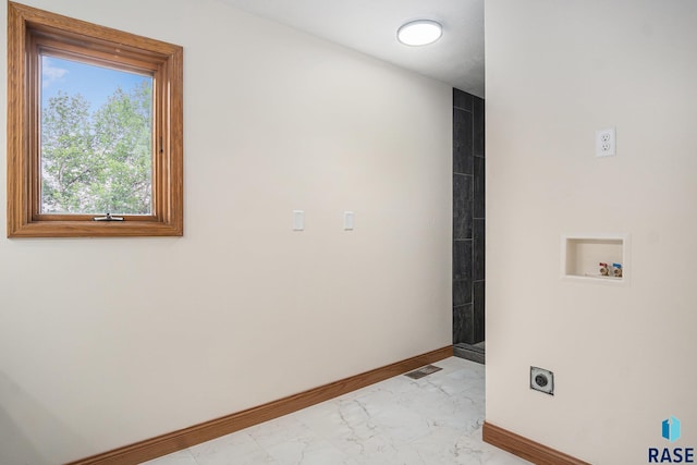 7604 E Palomino Rd, Sioux Falls, SD 57110 - laundry room featuring light marble finish flooring, electric dryer hookup, and hookup for a washing machine