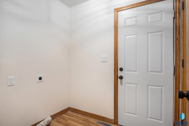 7604 E Palomino Rd, Sioux Falls, SD 57110 - laundry room featuring electric dryer hookup and light wood-style floors