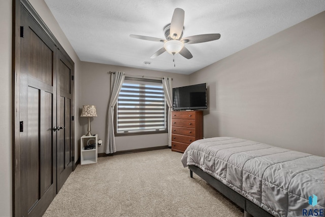 217 E Antioch St, Tea, SD 57064 - bedroom featuring light carpet, a textured ceiling, and a ceiling fan