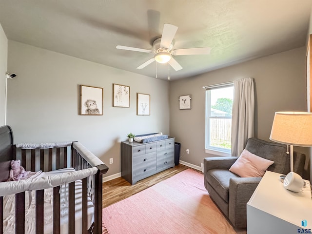 704 S Sneve Ave, Sioux Falls, SD 57103 - bedroom with light wood-type flooring and a ceiling fan
