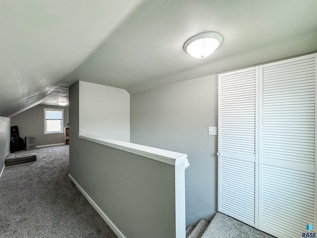 704 S Sneve Ave, Sioux Falls, SD 57103 - hall featuring lofted ceiling, carpet floors, and an upstairs landing