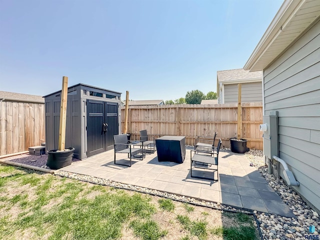 704 S Sneve Ave, Sioux Falls, SD 57103 - fenced backyard featuring a shed and a patio area