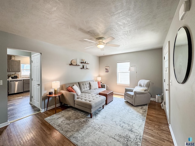 704 S Sneve Ave, Sioux Falls, SD 57103 - living area featuring a textured ceiling, a ceiling fan, and wood finished floors