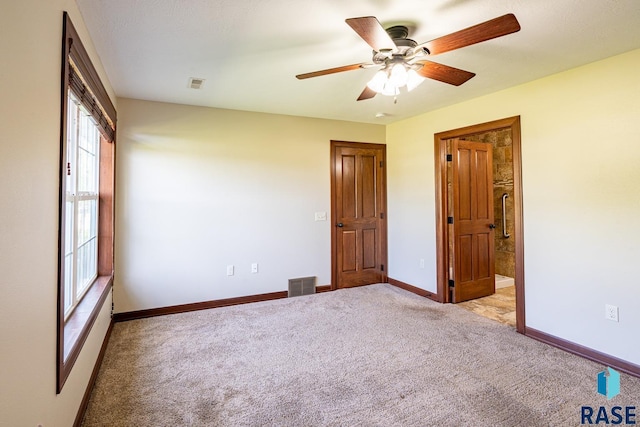 5509 E Eastbridge Pl, Sioux Falls, SD 57110 - unfurnished bedroom with light carpet and ceiling fan