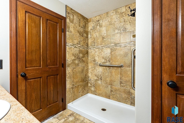 5509 E Eastbridge Pl, Sioux Falls, SD 57110 - full bathroom featuring a tile shower and vanity