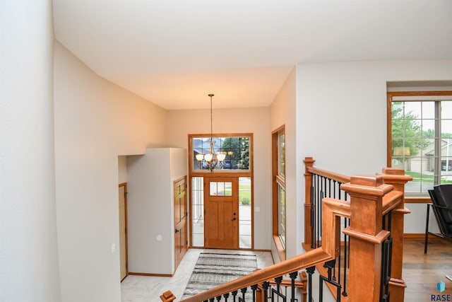 6312 S Heatherridge Ave, Sioux Falls, SD 57108 - foyer with a chandelier and baseboards