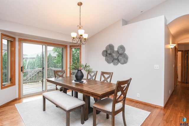 6312 S Heatherridge Ave, Sioux Falls, SD 57108 - dining space featuring vaulted ceiling, a chandelier, and light wood-style floors