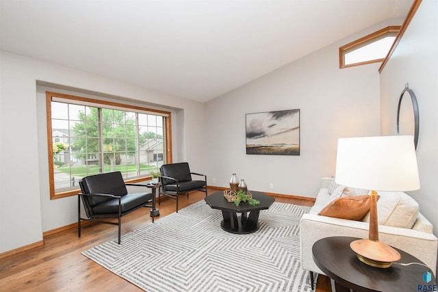 6312 S Heatherridge Ave, Sioux Falls, SD 57108 - living room with vaulted ceiling and light wood finished floors