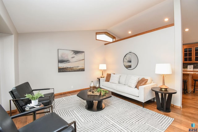 6312 S Heatherridge Ave, Sioux Falls, SD 57108 - living area featuring lofted ceiling, wood finished floors, recessed lighting, and a desk