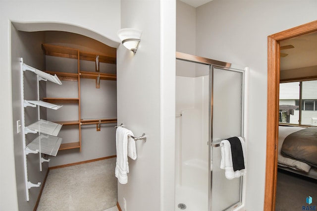 6312 S Heatherridge Ave, Sioux Falls, SD 57108 - full bathroom featuring a stall shower and a walk in closet