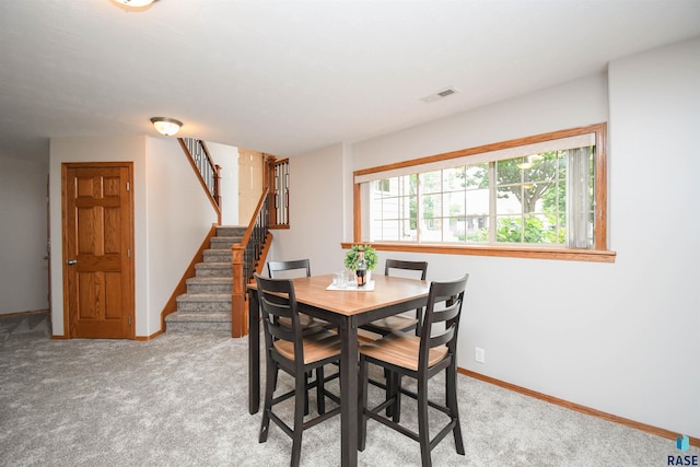 6312 S Heatherridge Ave, Sioux Falls, SD 57108 - dining room with carpet floors and stairway