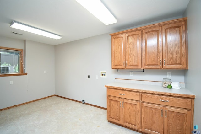 6312 S Heatherridge Ave, Sioux Falls, SD 57108 - washroom featuring hookup for an electric dryer, cabinet space, and washer hookup