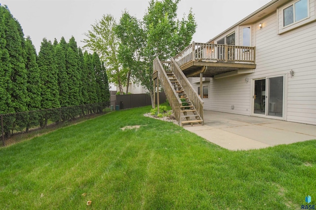 6312 S Heatherridge Ave, Sioux Falls, SD 57108 - fenced backyard featuring stairway, a patio, and a wooden deck