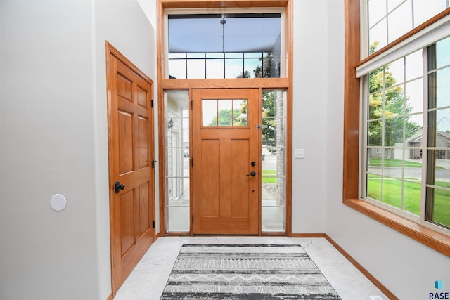 6312 S Heatherridge Ave, Sioux Falls, SD 57108 - foyer entrance featuring healthy amount of natural light, light marble finish flooring, and a high ceiling