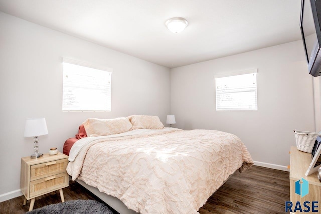 3601 S Holbrook Ave, Sioux Falls, SD 57106 - bedroom with baseboards and dark wood-style flooring