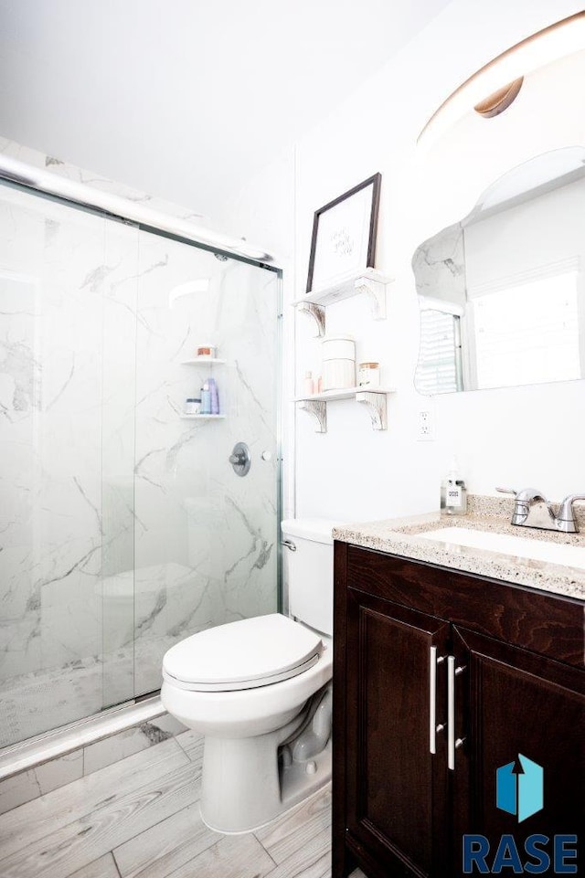 3601 S Holbrook Ave, Sioux Falls, SD 57106 - bathroom with vanity and a marble finish shower