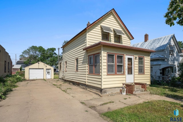 1407 N Main Ave, Sioux Falls, SD 57104 - view of front of home with a garage, an outdoor structure, and concrete driveway