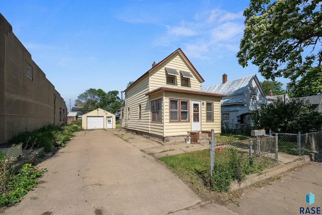 1407 N Main Ave, Sioux Falls, SD 57104 - view of front of property featuring a garage, driveway, and an outbuilding