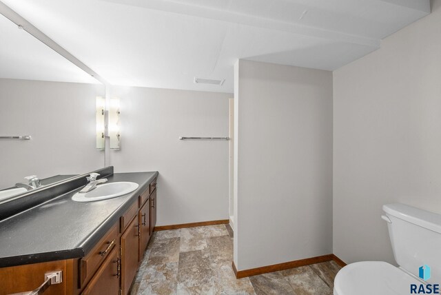 501 S Josephine Ave, Hills, MN 56138 - bathroom with vanity and stone finish flooring