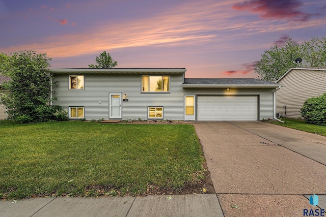 5909 W Bakker Park Dr, Sioux Falls, SD 57106 - view of front of house with an attached garage, a front lawn, and driveway