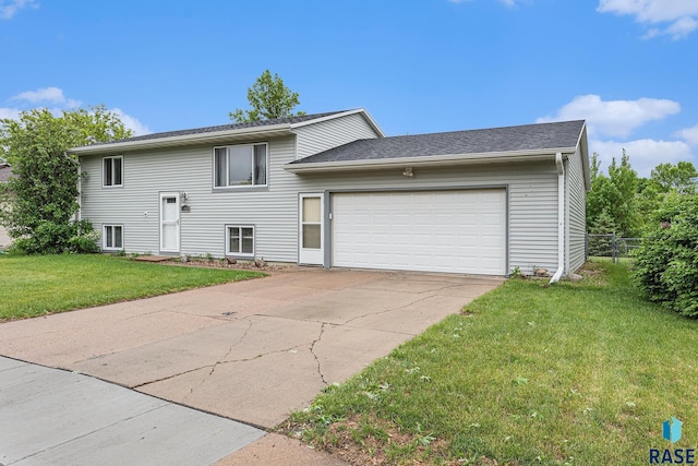 5909 W Bakker Park Dr, Sioux Falls, SD 57106 - split foyer home with a garage and driveway