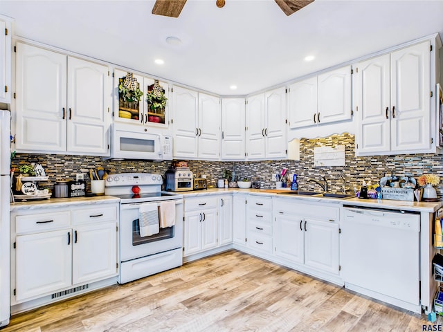 26481 487th Ave, Valley Springs, SD 57068 - kitchen featuring white appliances, light countertops, white cabinetry, and recessed lighting