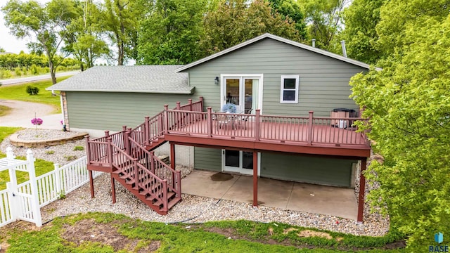 26481 487th Ave, Valley Springs, SD 57068 - rear view of house featuring a wooden deck, a patio, and stairs