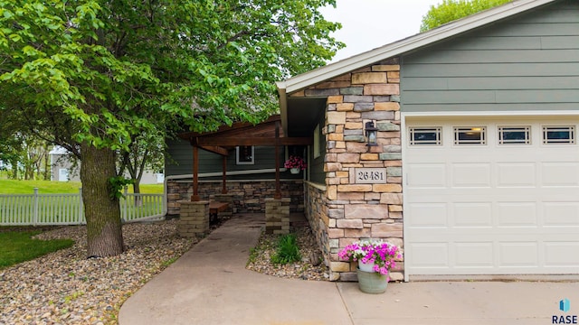26481 487th Ave, Valley Springs, SD 57068 - exterior space with stone siding and a garage