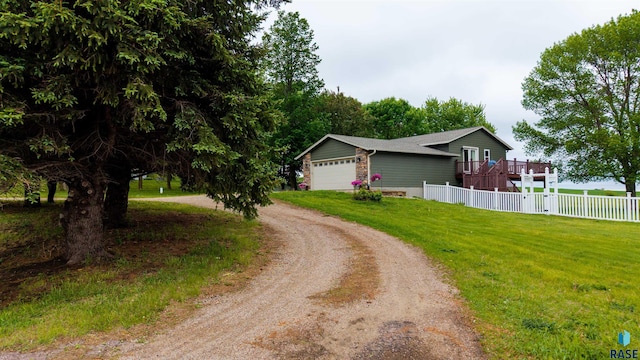 26481 487th Ave, Valley Springs, SD 57068 - view of side of property with driveway, an attached garage, and a wooden deck