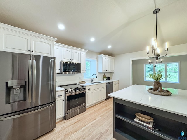 1708 E Ash Grove Cir, Sioux Falls, SD 57108 - kitchen featuring stainless steel appliances, light wood-style flooring, white cabinets, hanging light fixtures, and recessed lighting