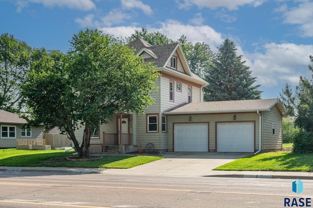 108 S Sycamore Ave, Sioux Falls, SD 57110 - view of front of home with a garage, concrete driveway, a front lawn, and roof with shingles