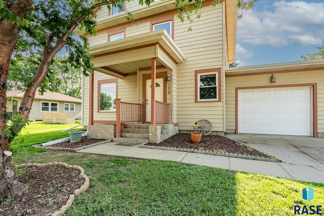 108 S Sycamore Ave, Sioux Falls, SD 57110 - view of front facade featuring driveway, a front lawn, and an attached garage