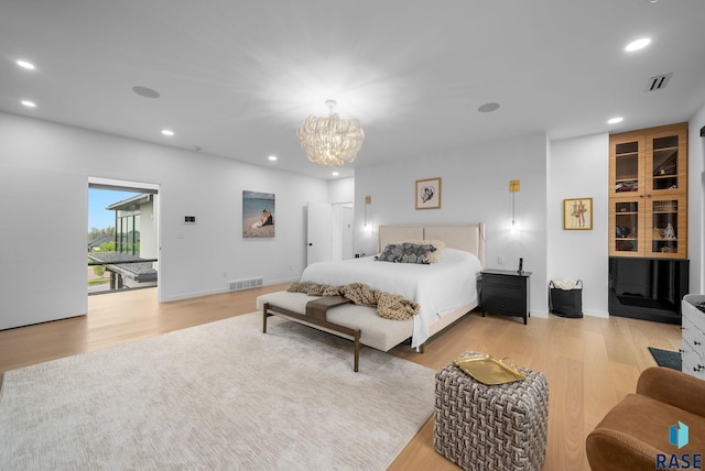 8009 Windswept Cir, Sioux Falls, SD 57108 - bedroom with light wood-style floors, recessed lighting, and a chandelier