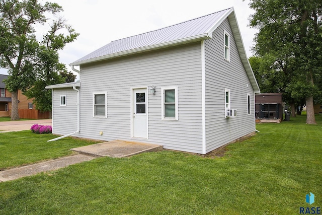 129 S Main Ave, Colman, SD 57017 - rear view of property with a lawn, a metal roof, and cooling unit