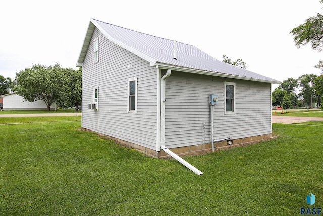 129 S Main Ave, Colman, SD 57017 - view of side of property with a yard and a metal roof