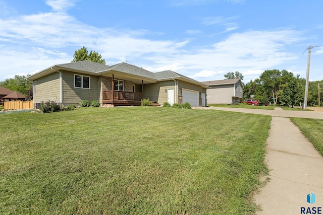 908 W 4th Ave, Lennox, SD 57039 - view of front of house featuring a garage, concrete driveway, and a porch