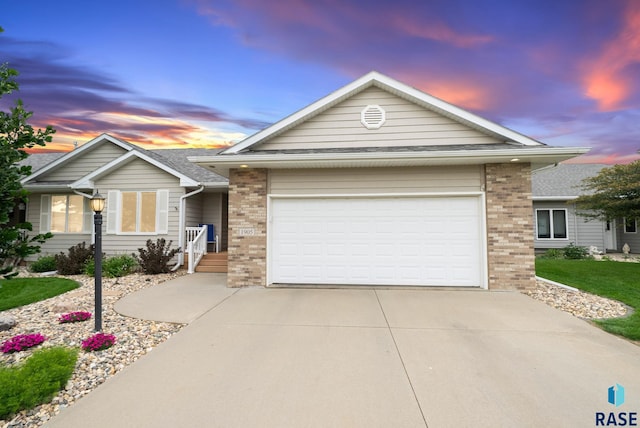 1905 S Wheatland Ct, Sioux Falls, SD 57106 - single story home featuring brick siding, driveway, and an attached garage