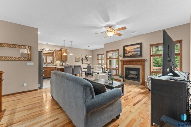 2213 S Purdue Ave, Sioux Falls, SD 57106 - living room with ceiling fan, light wood-style floors, a fireplace, healthy amount of natural light, and recessed lighting