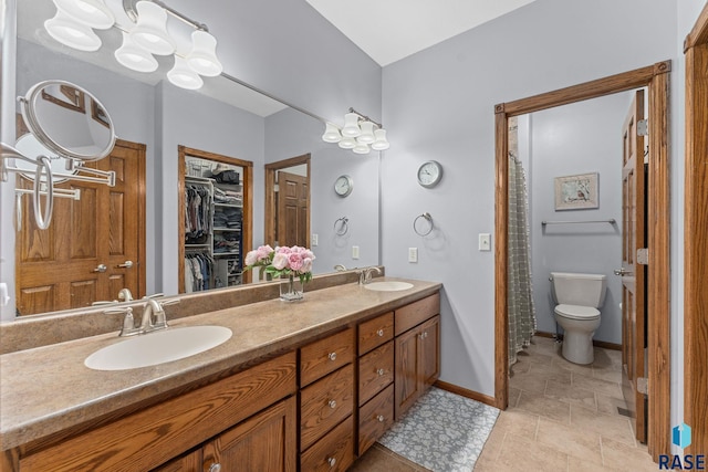 2213 S Purdue Ave, Sioux Falls, SD 57106 - bathroom with double vanity and a spacious closet