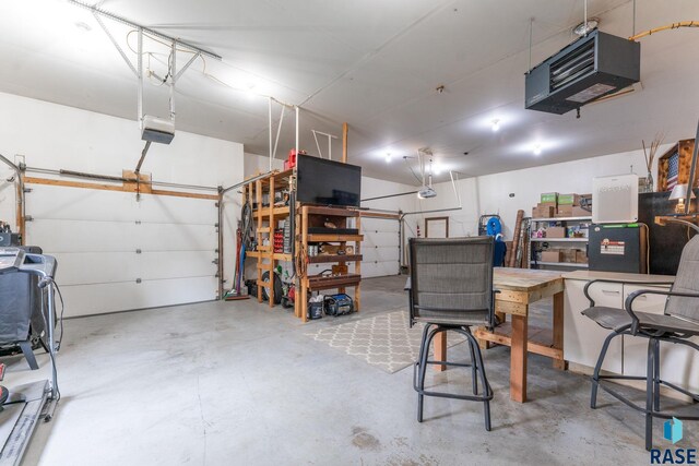2213 S Purdue Ave, Sioux Falls, SD 57106 - garage with a garage door opener and a heating unit