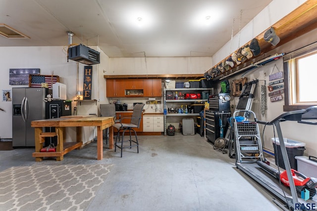 2213 S Purdue Ave, Sioux Falls, SD 57106 - garage with stainless steel fridge with ice dispenser and a heating unit