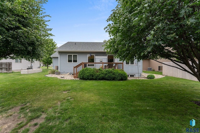2213 S Purdue Ave, Sioux Falls, SD 57106 - rear view of house featuring a deck, a yard, and a shingled roof