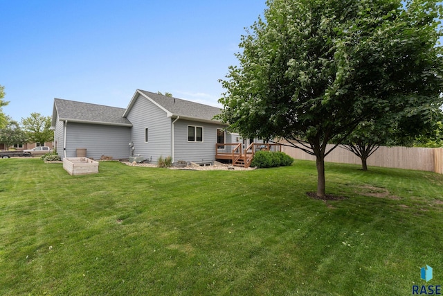 2213 S Purdue Ave, Sioux Falls, SD 57106 - rear view of house featuring a wooden deck and roof with shingles