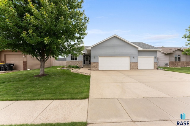 2213 S Purdue Ave, Sioux Falls, SD 57106 - view of front of home featuring an attached garage, concrete driveway, brick siding, and a front yard