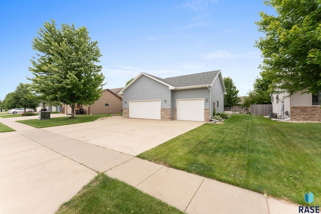 2213 S Purdue Ave, Sioux Falls, SD 57106 - view of front of property with a front lawn, driveway, a garage, and a shingled roof