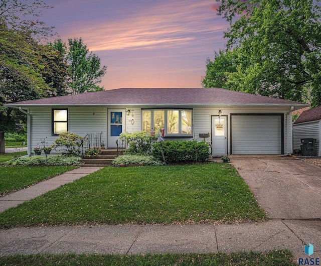 508 E Crawford St, Luverne, MN 56156 - ranch-style home with a garage, concrete driveway, and a front yard