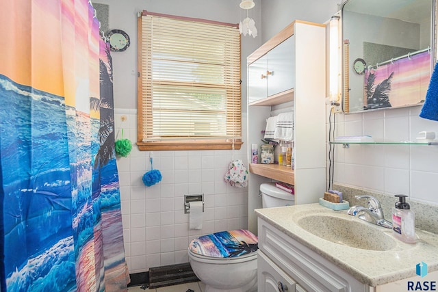 508 E Crawford St, Luverne, MN 56156 - full bathroom featuring tile walls, vanity, and a shower with curtain