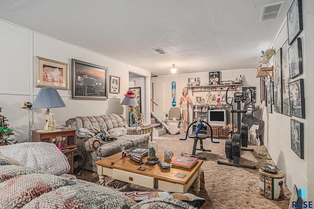 508 E Crawford St, Luverne, MN 56156 - carpeted living area featuring a textured ceiling