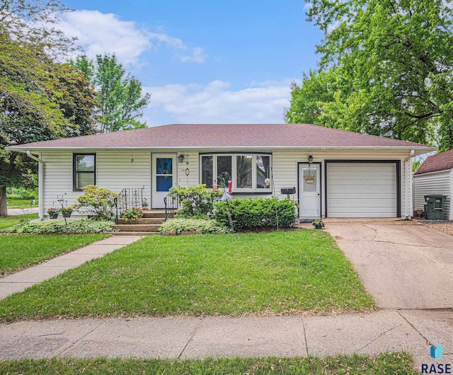 508 E Crawford St, Luverne, MN 56156 - single story home featuring an attached garage, driveway, a front lawn, and roof with shingles